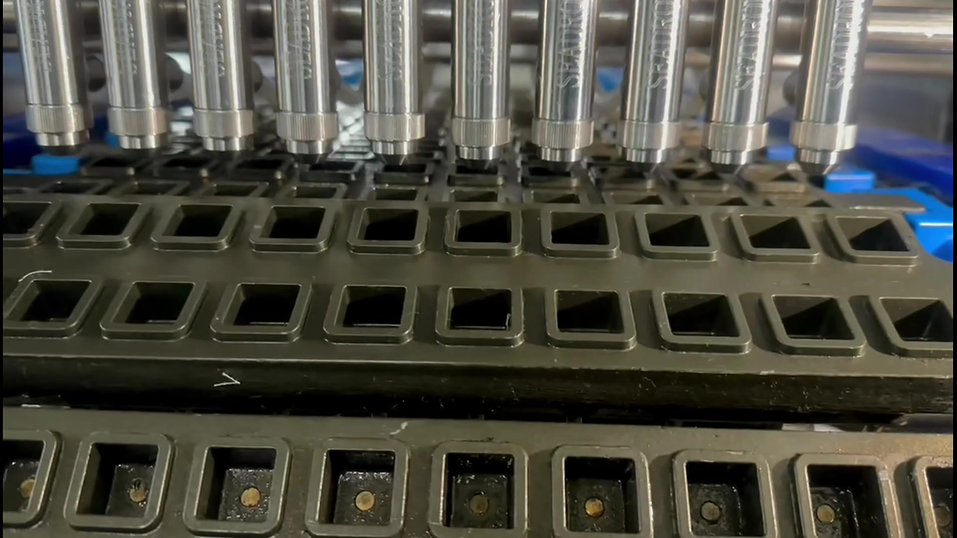 Candy mold release spraying — real production footage